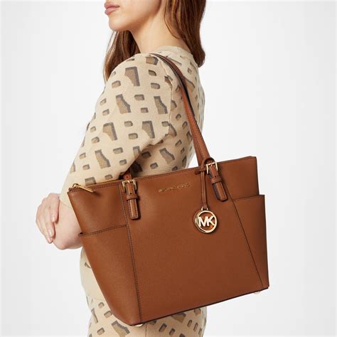 michael kors jet set tote purse|Michael Kors airplane print bag.